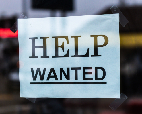 Help wanted sign in a window - for a blog post on When’s It Time To Hire Help For Your Social?